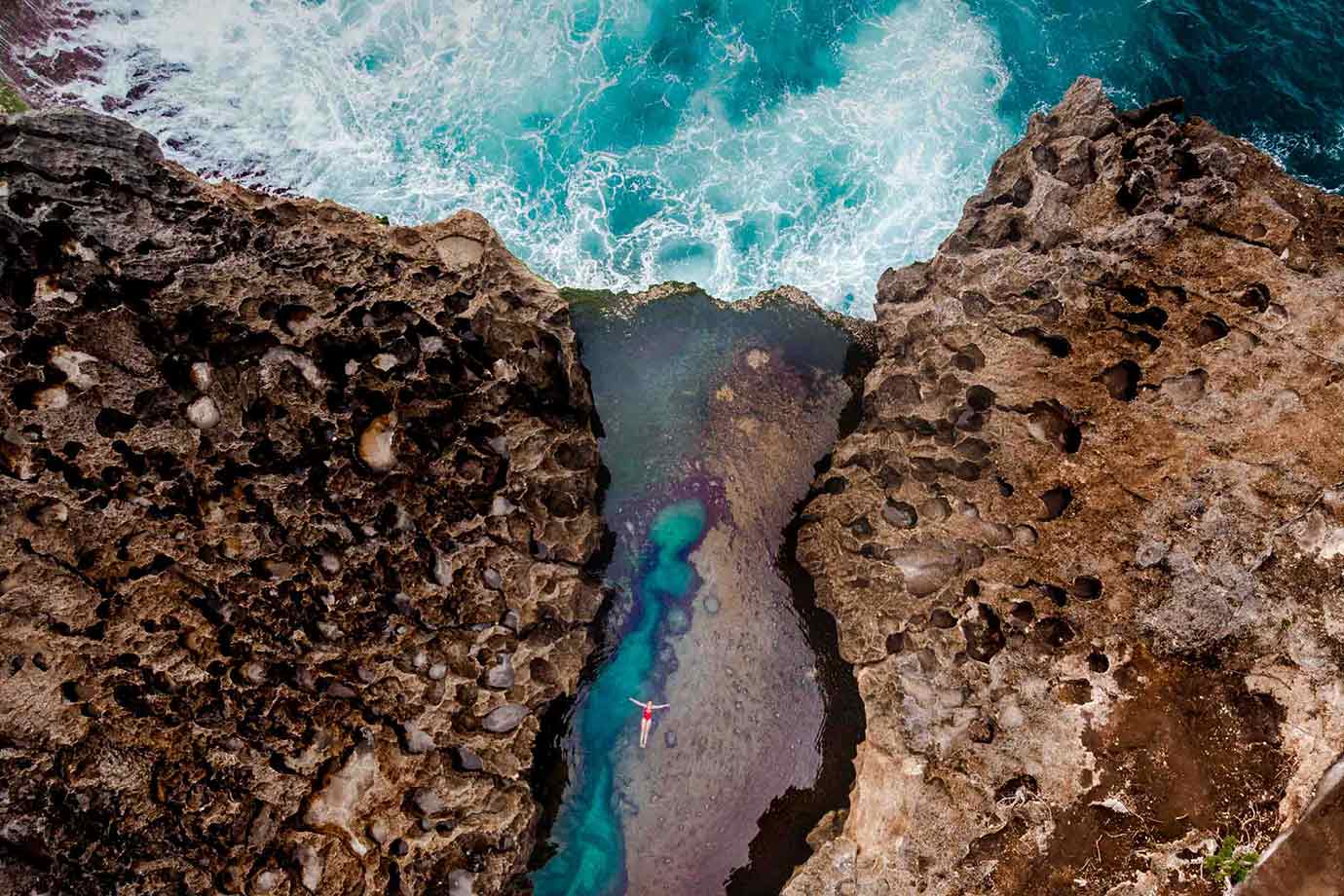 Woman in the waters of Angel’s Billabong Beach