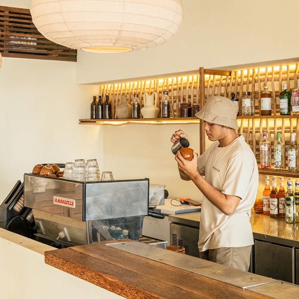Barman cooking coffee in Moreno