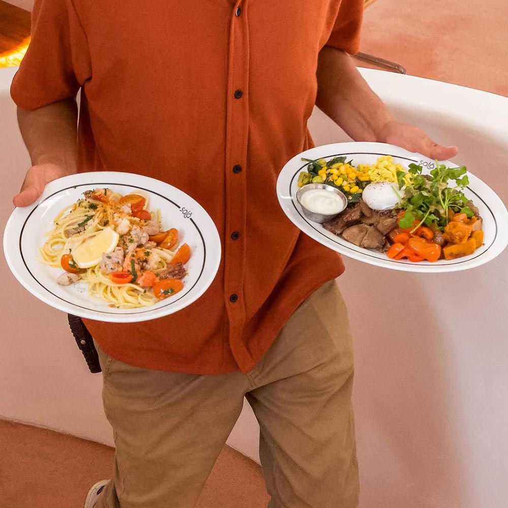 Waiter with food in Sala Ubud restaurant
