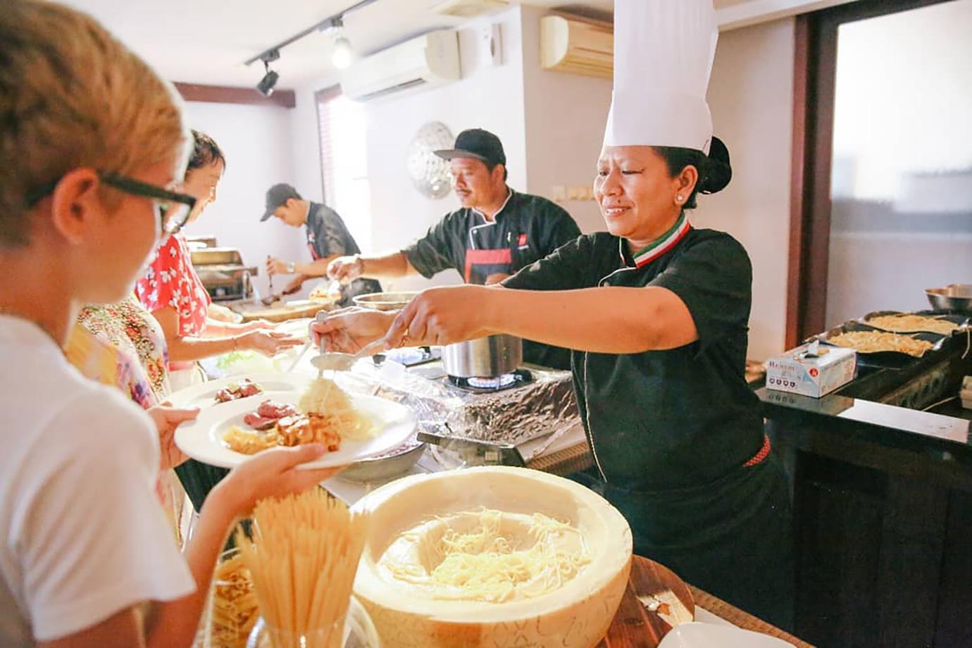 Cooking pasta in The Village Cucina Italiana