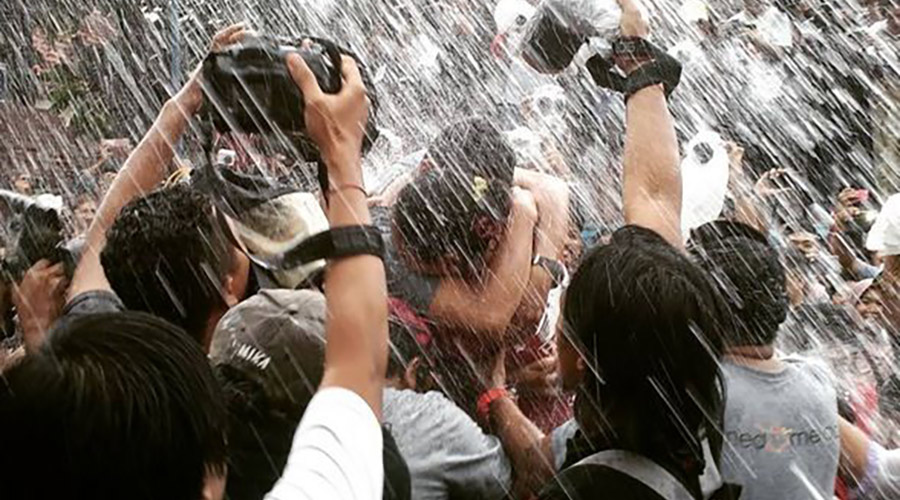Pouring water at The kissing festival