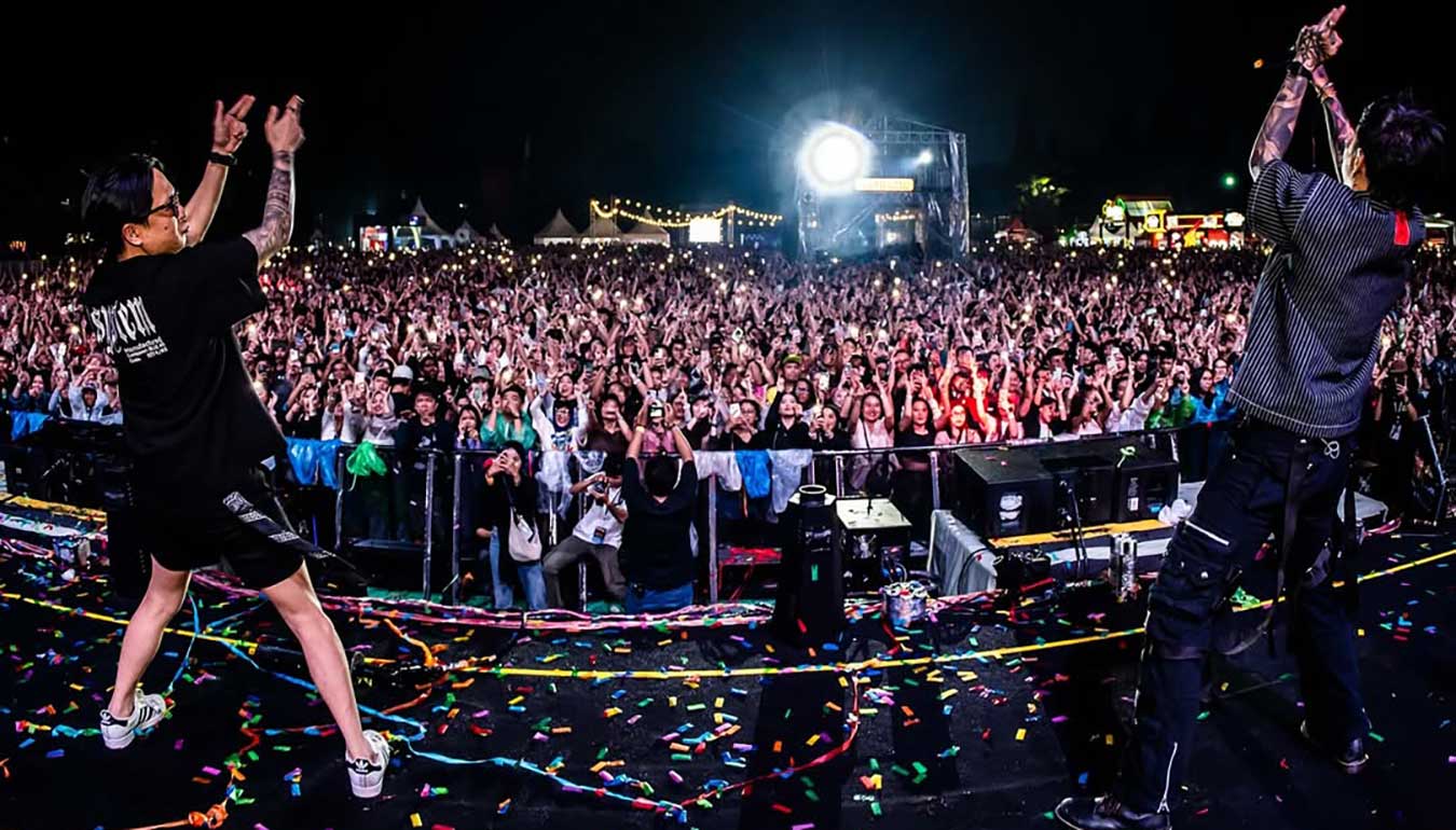 Two DJs on the stage at festival