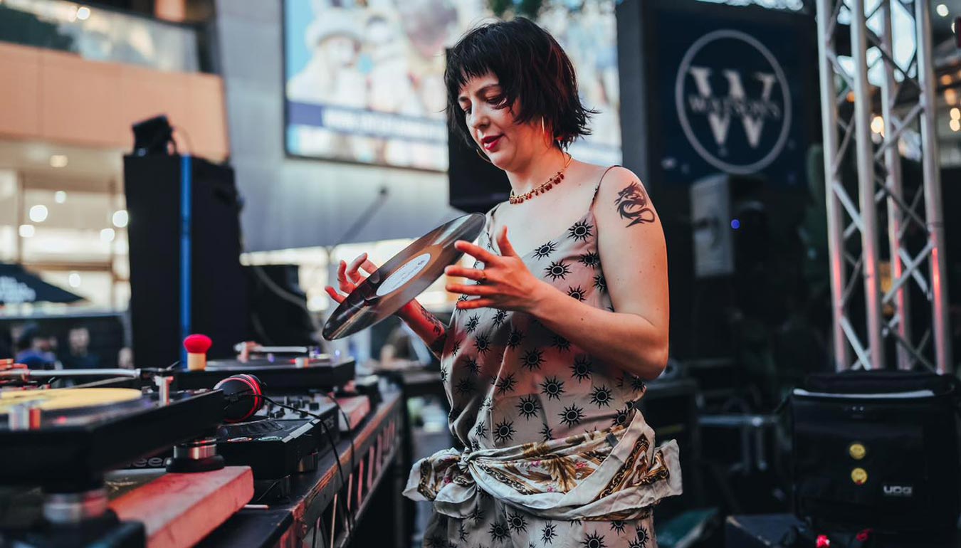 Woman DJ from S.A.S.H with the vinyl