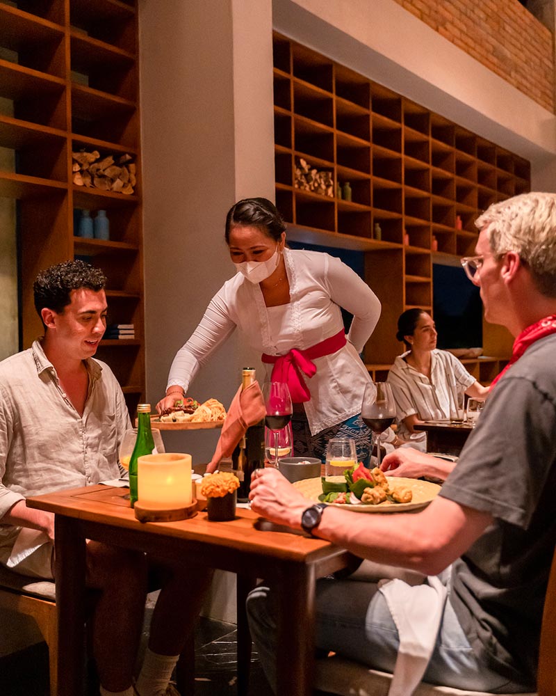 Bringing food to the clients in Copper Kitchen