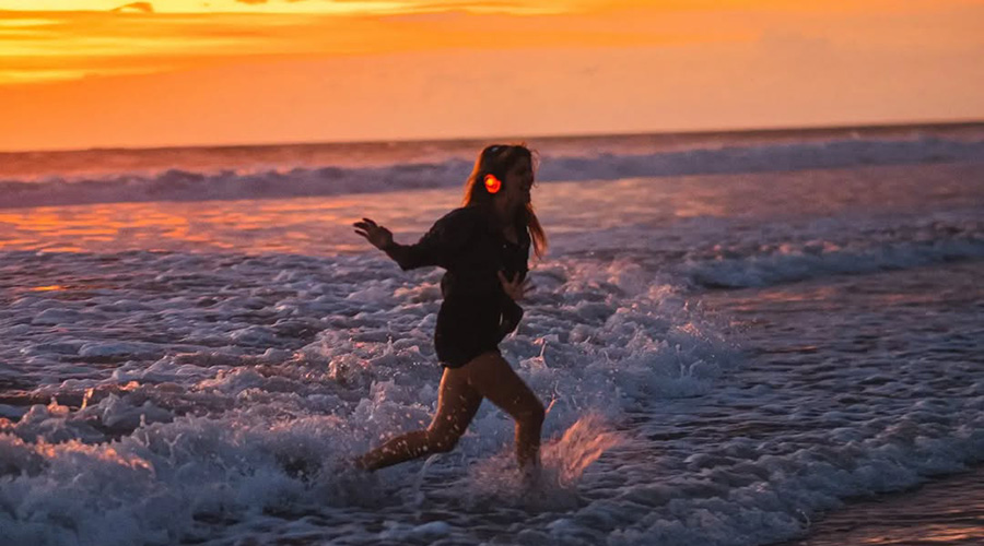 Woman dancing on the beach