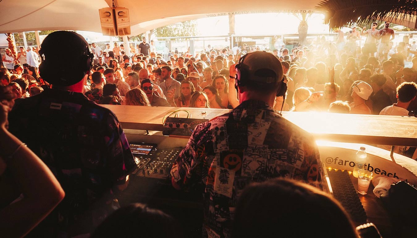 Back view of DJ set in night club