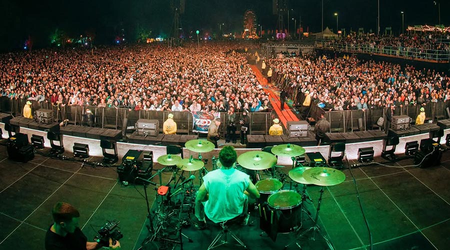 Zedd musician sits behind the drums