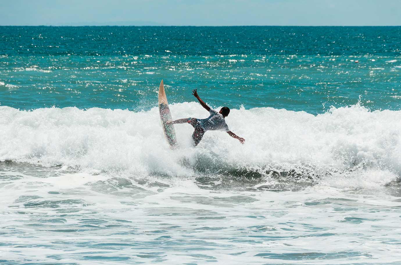Surfing bear the Kuta beach