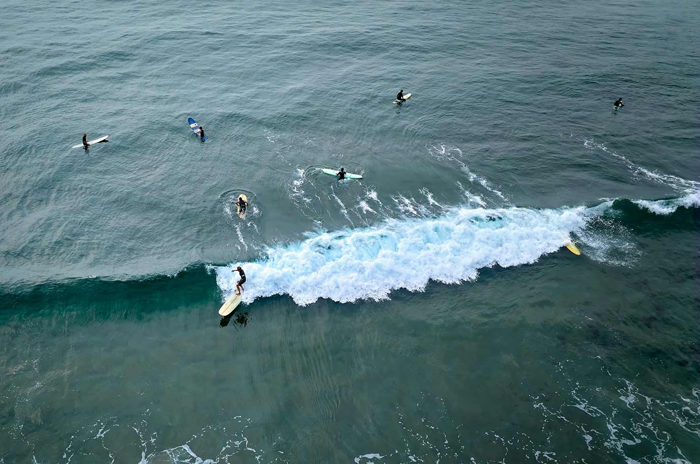 Surfing at Kuta Beach Waves