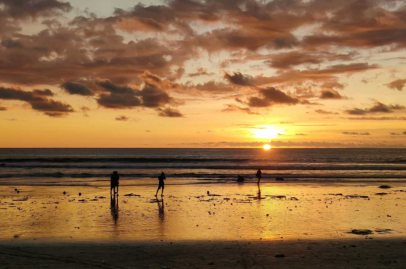 Walking along Kuta beach during the sunset