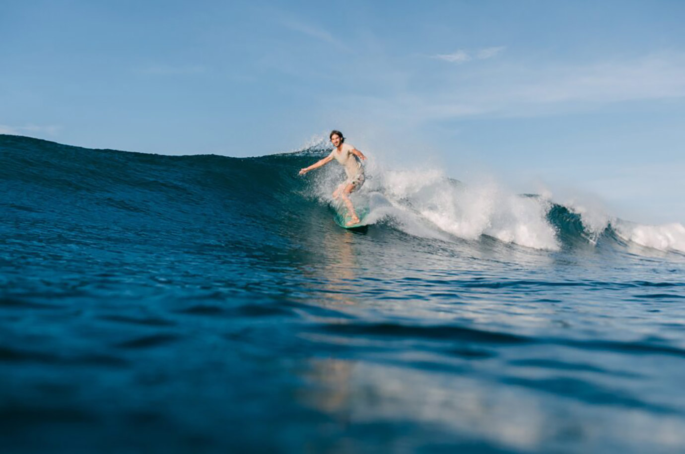 Surfing on the wave near Sanur beach