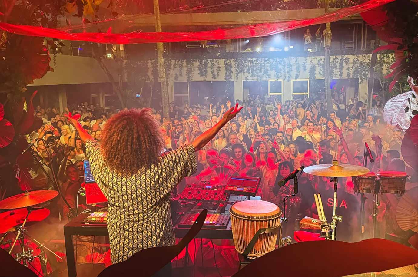DJ and live musicians on the stage on night club