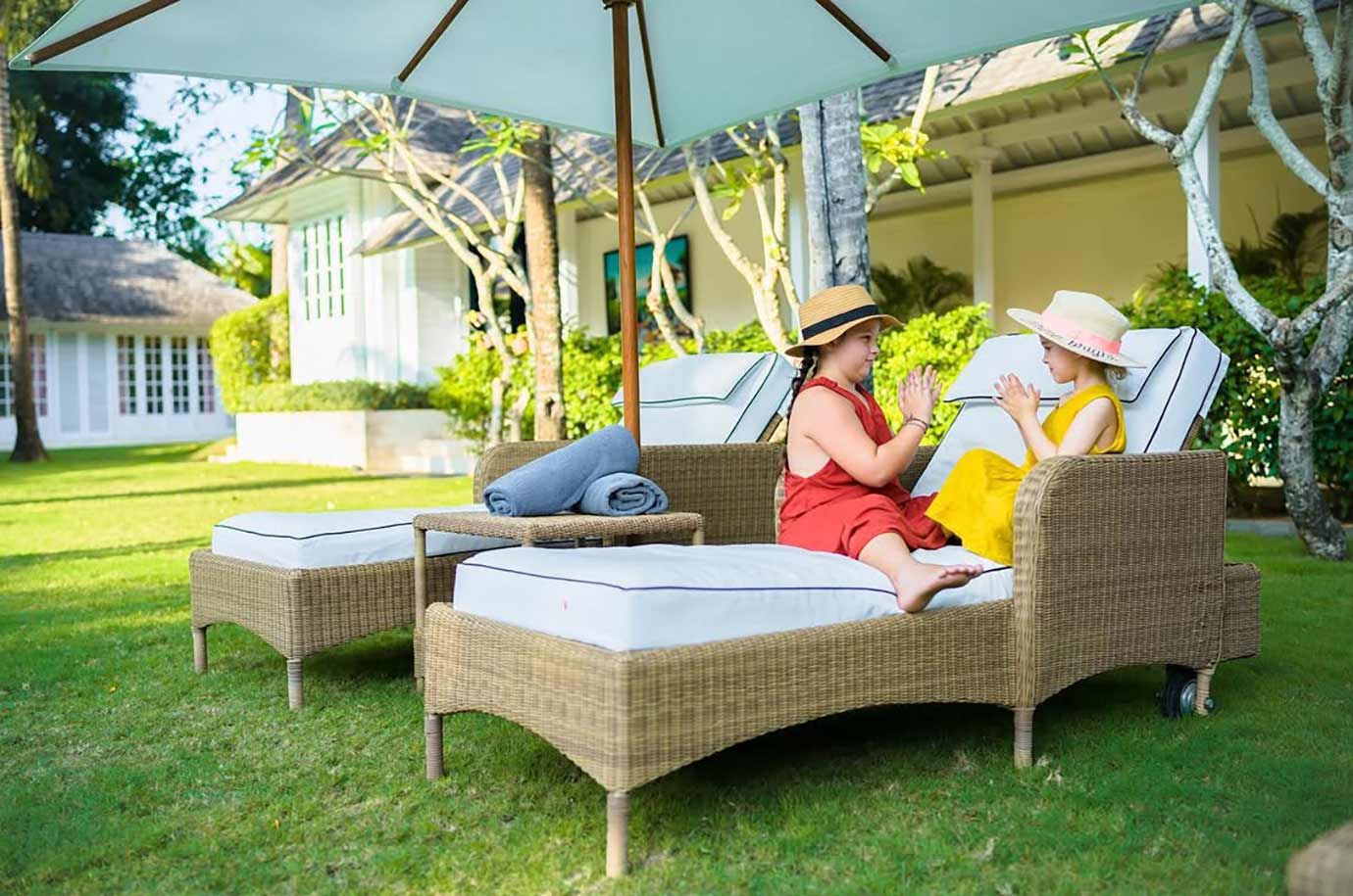 Kids playing on The Cotton House sunloungers