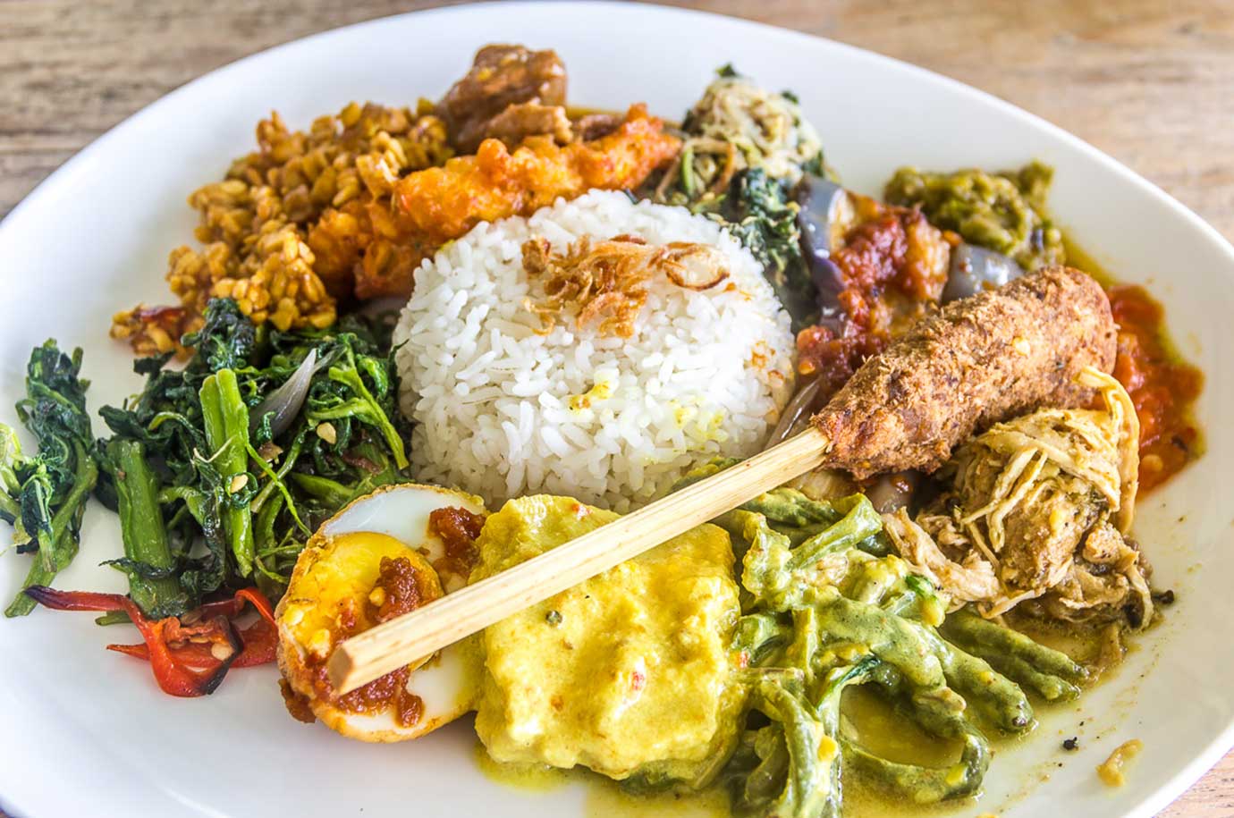 Nasi Campur on the plate of restaurant in Bali