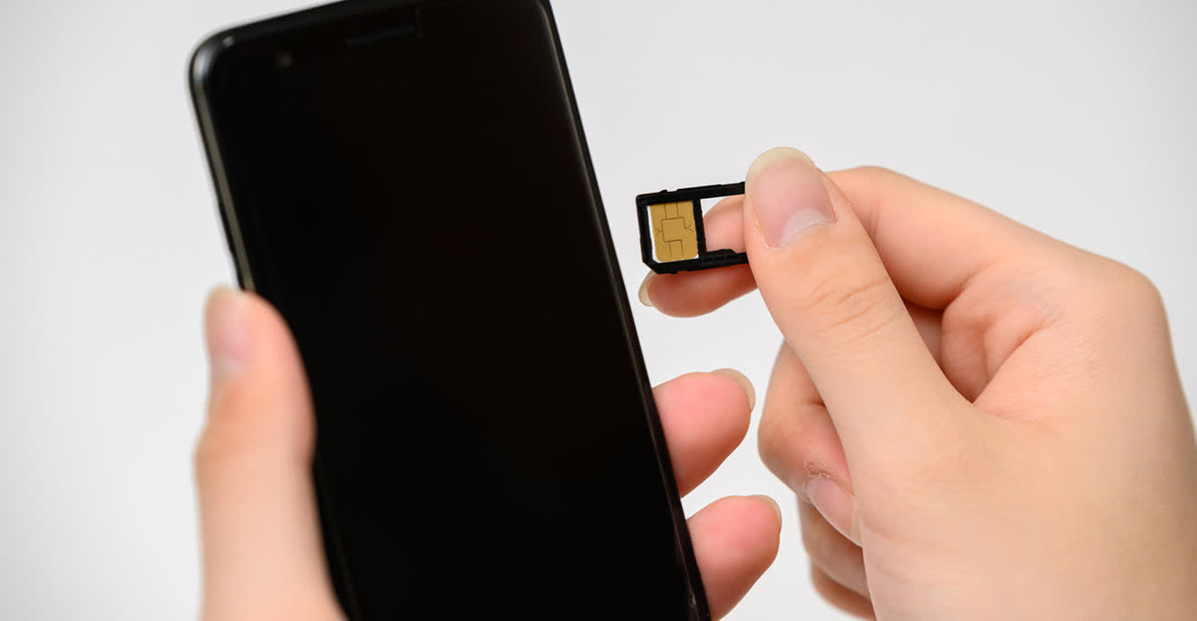 Sim card and the smartphone in the hands