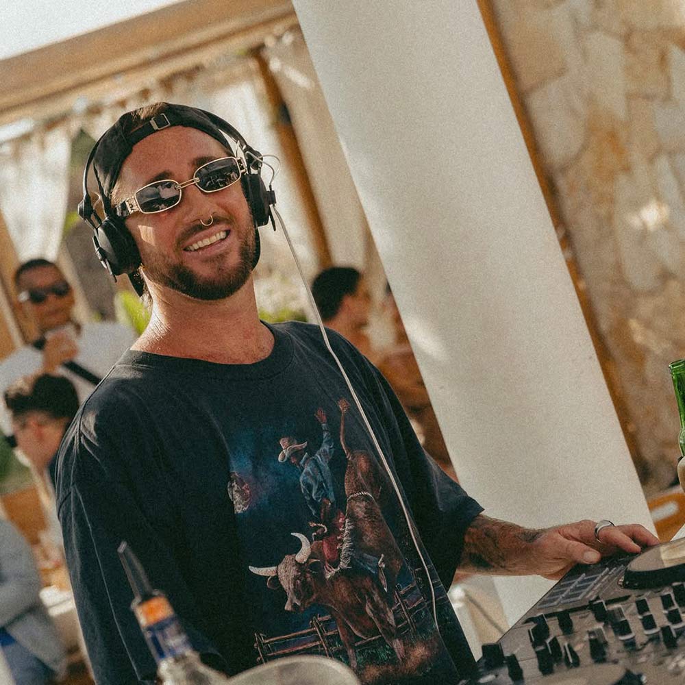 DJ performs at Lima Bay beach club