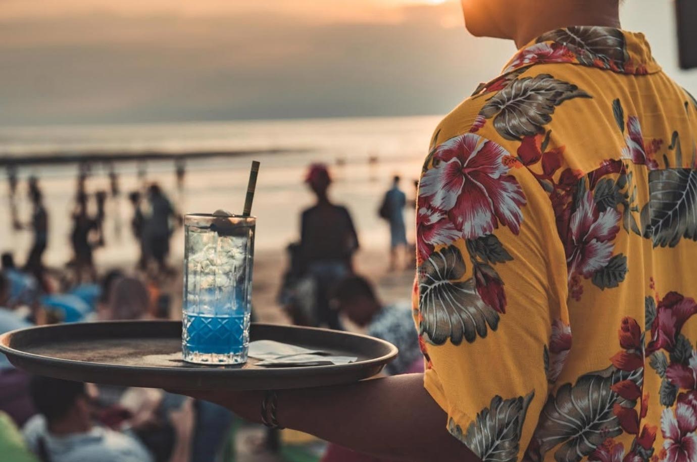 Waiter with drink from La Plancha in Seminyak
