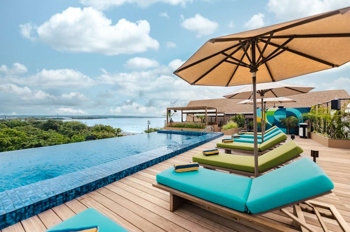 Sun loungers and pool in the Kuta Social Club Rooftop