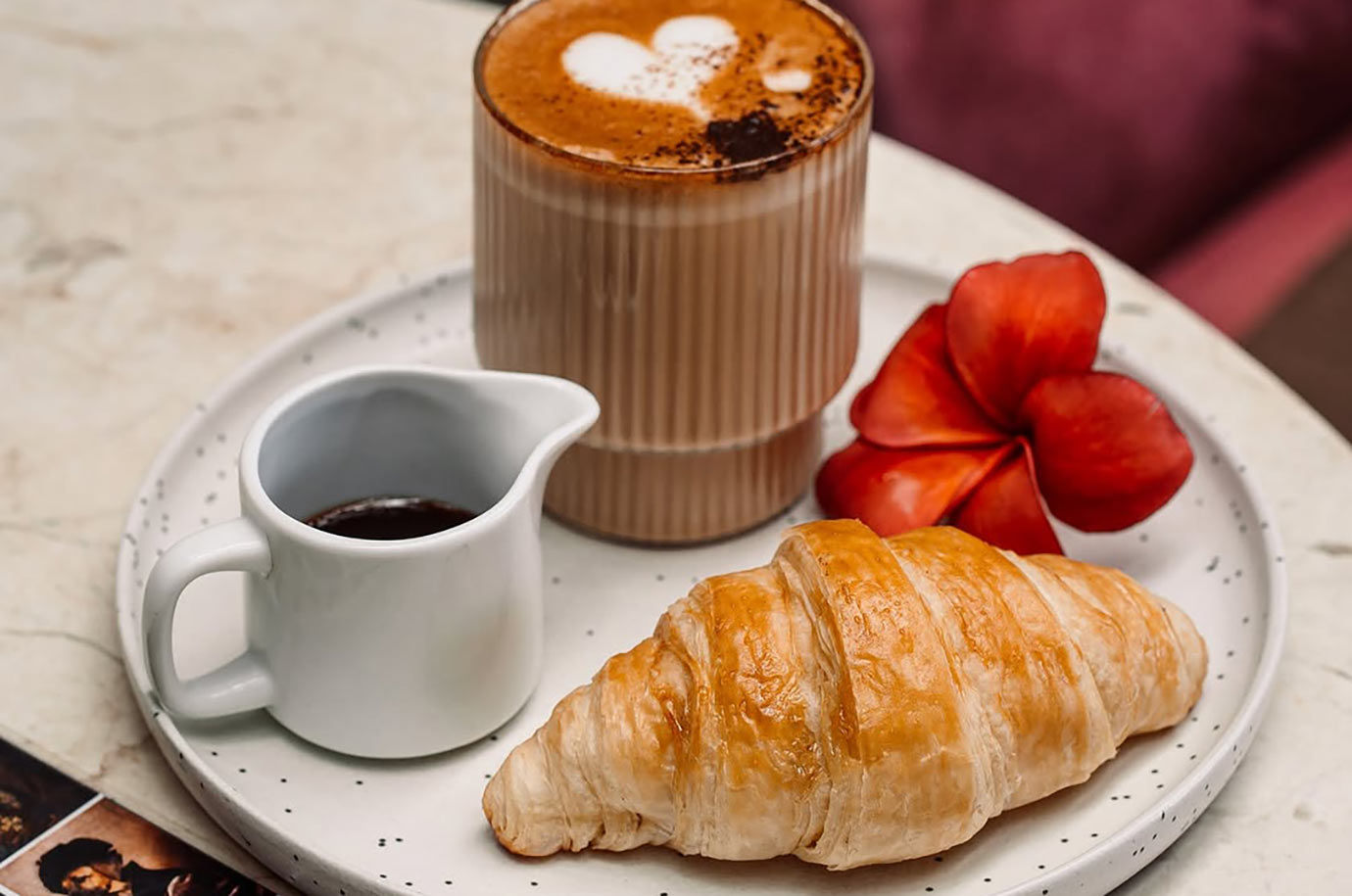 Croissant and coffee in Lazy Cats Café
