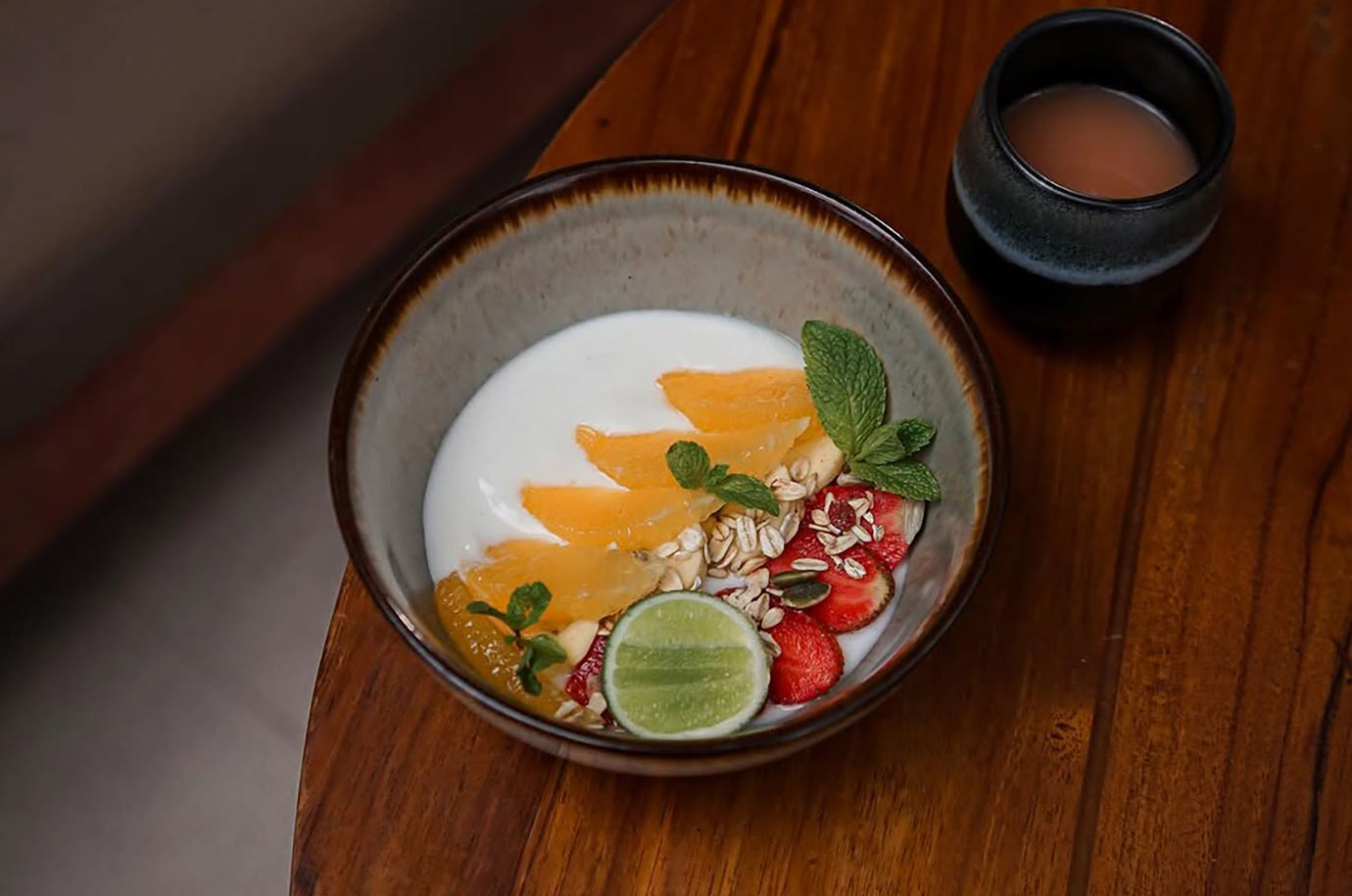 Akasa Cafe offers yoghurt with the fruits and fresh juice on breakfast