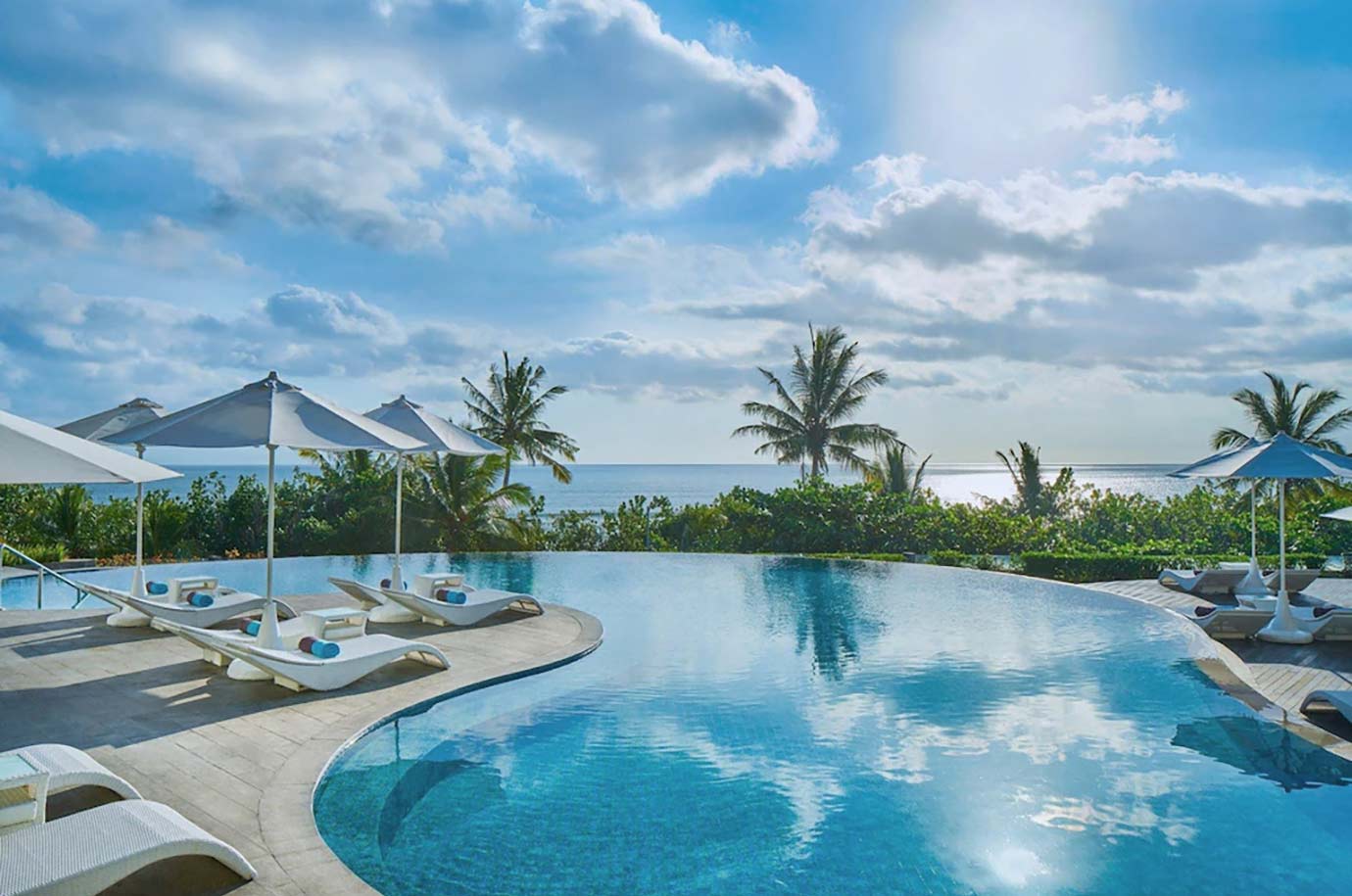 Lagoon swimming pool with sun loungers from Sheraton hotel