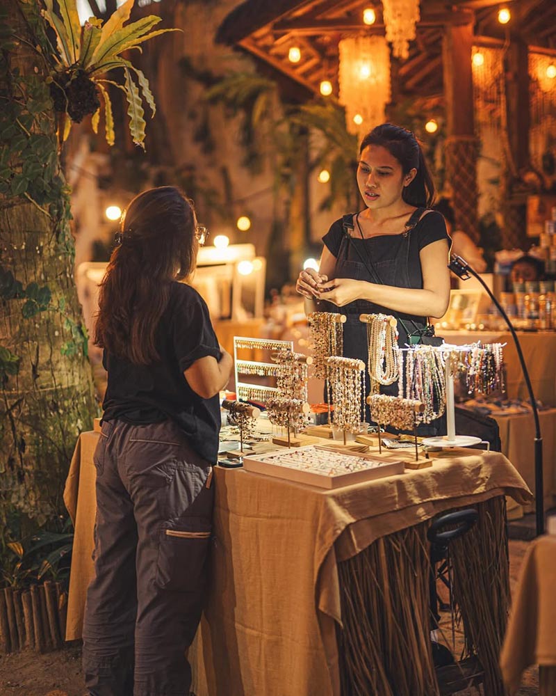 Buying jewellery at La Brisa Sunday Market