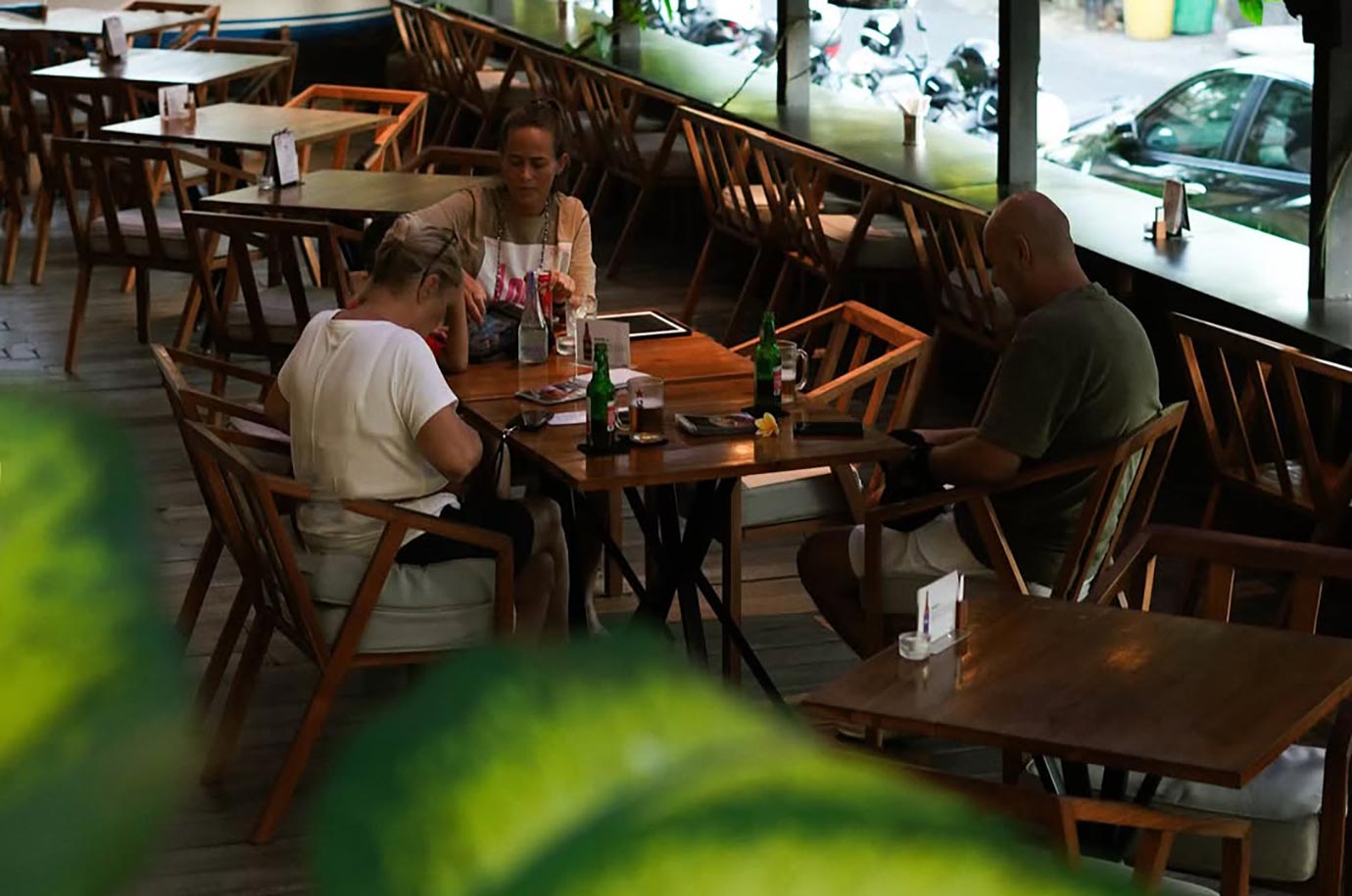 Wooden tables in Lidah Lokal restaurant