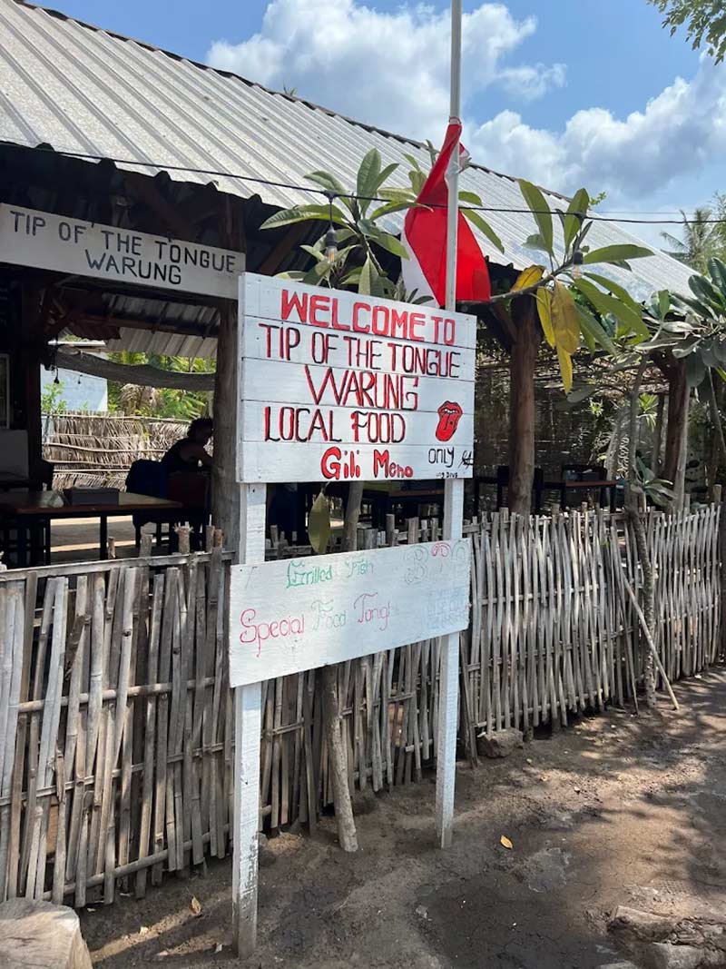 Welcoming signboard to the Tip of the Tongue Warung