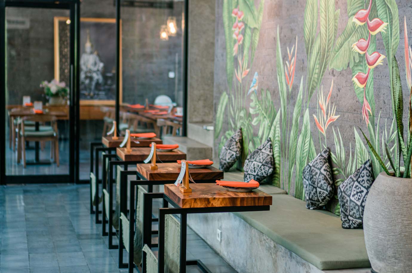 Interior with flower paintings on the wall in Paed Thai Sanur