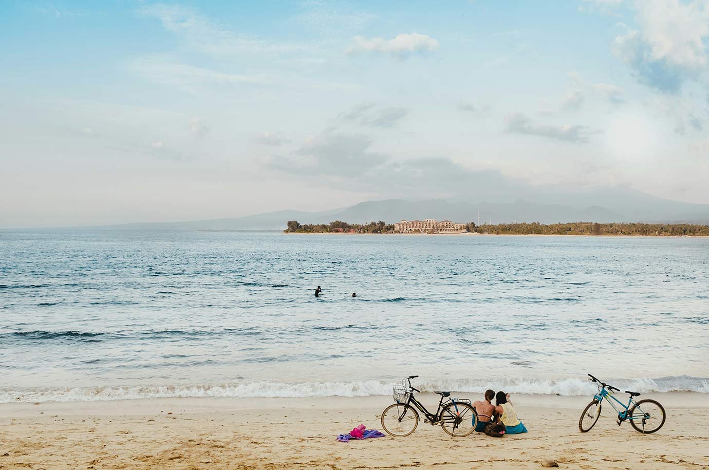 Couple of cyclists at Mango Bay Beach