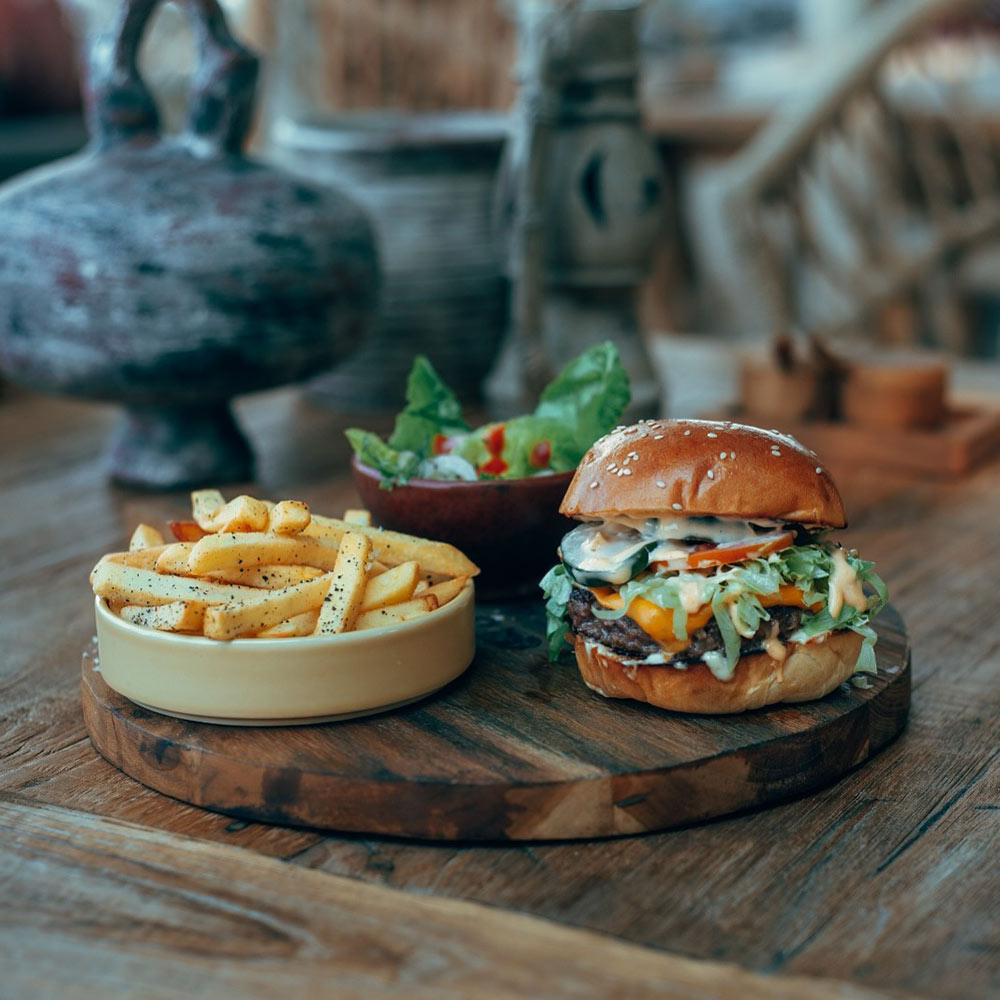 Burger and french fries from La Cala Beach Club