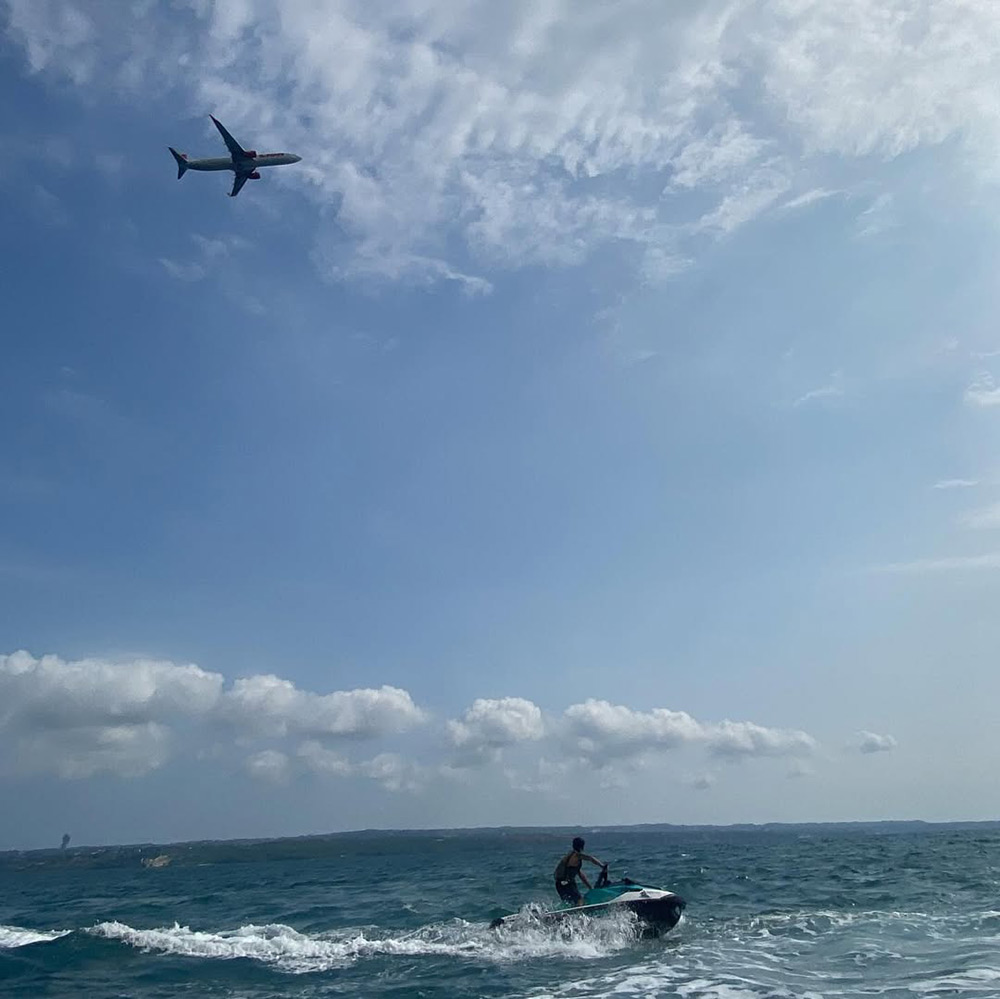 Jet Ski Prestige on the water under the plane