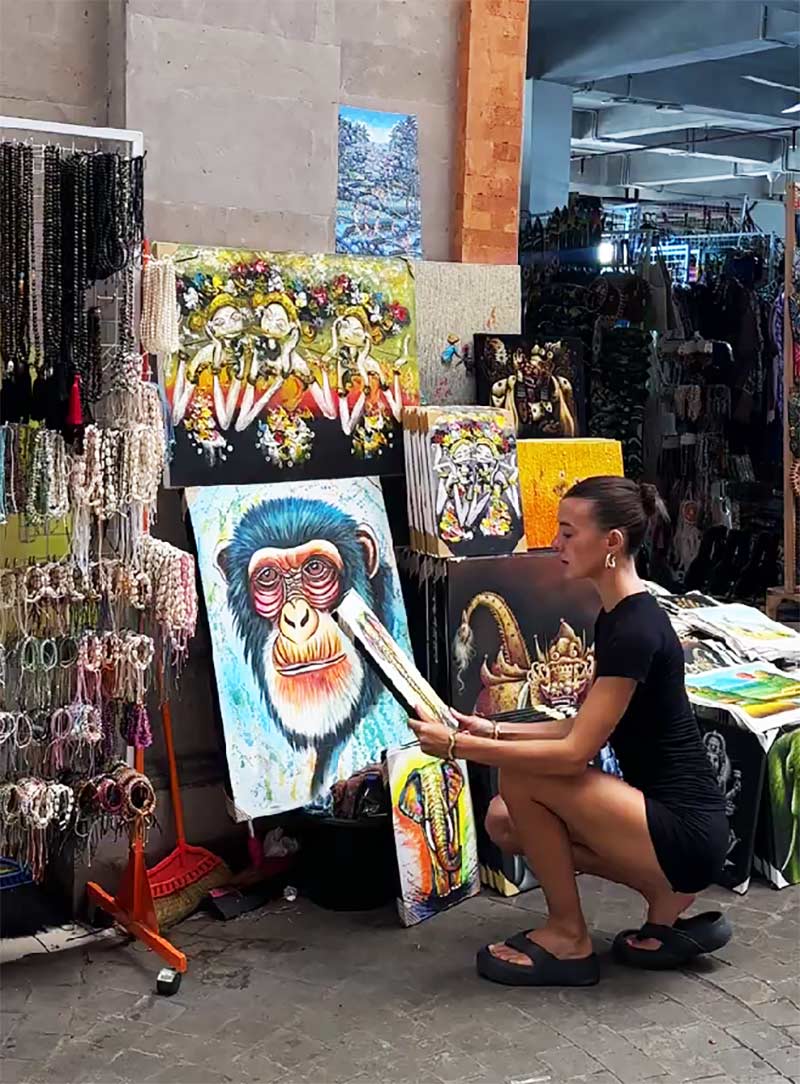 Shopping paintings at Ubud Art Market