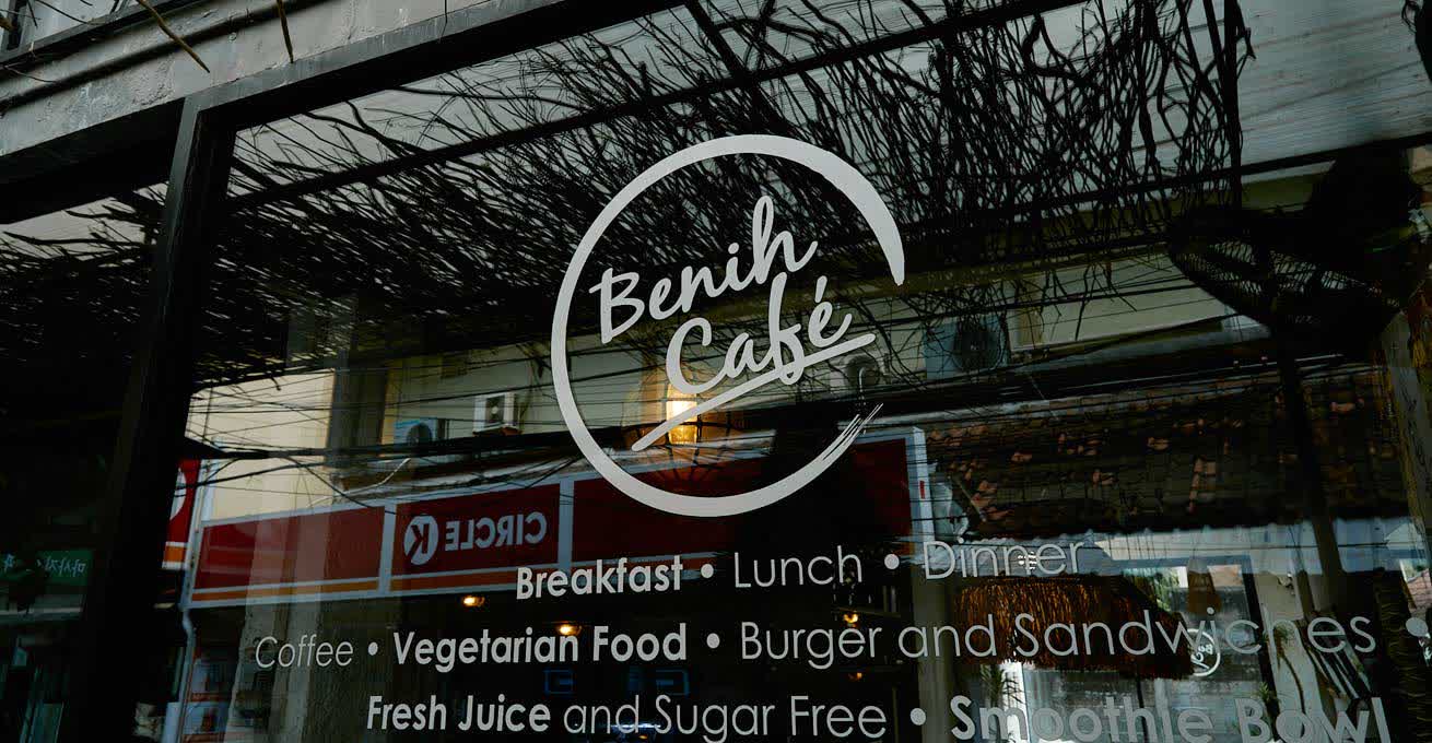 Benih Cafe - the name and cafe menu on the glasswall