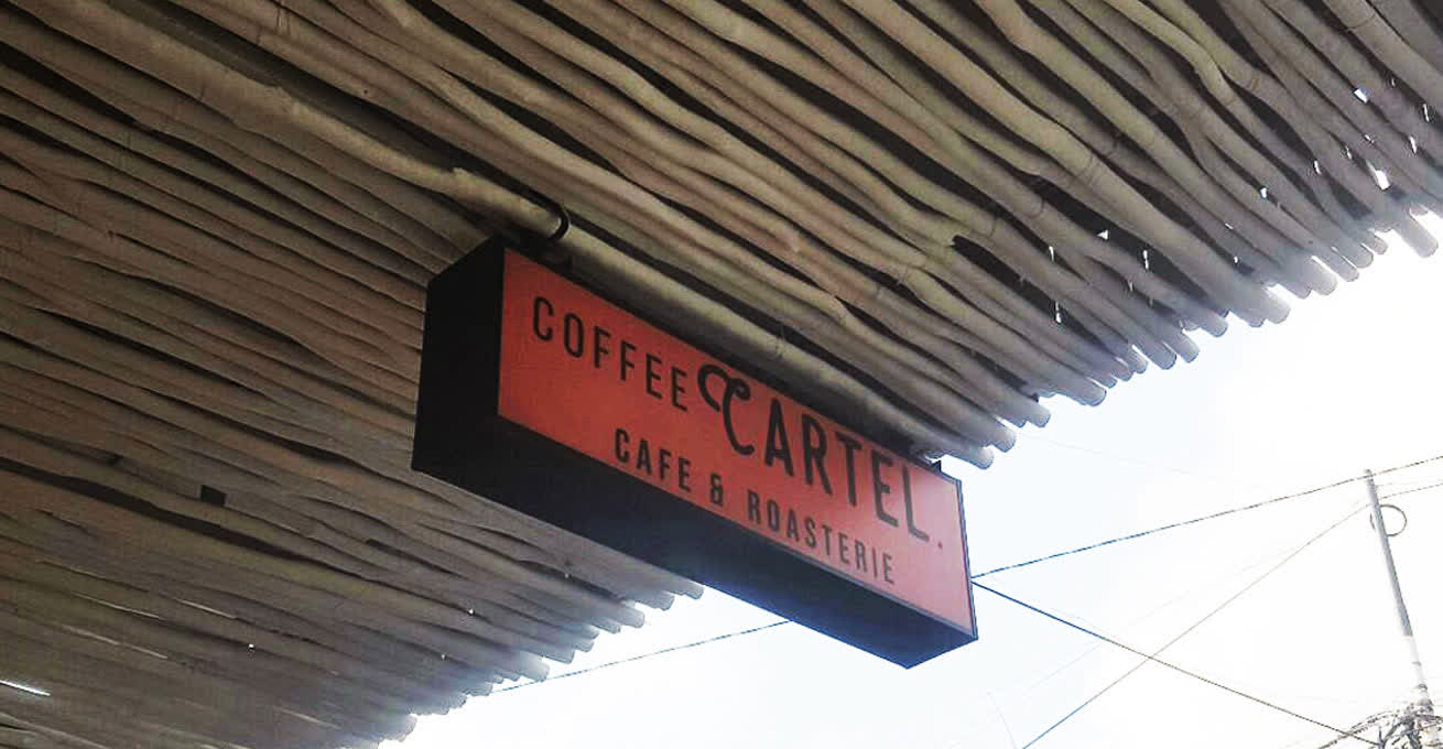 The red signboard of Coffee Cartel cafe