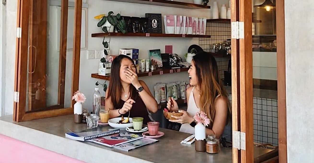 Laughing girls during the breakfast in Coffee Cartel