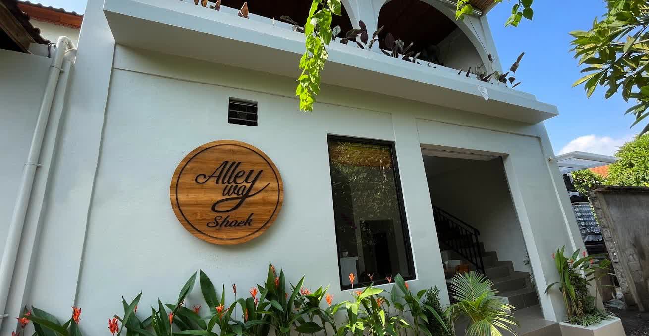 The facade with the signboard and entrance to The Alleyway Shack cafe