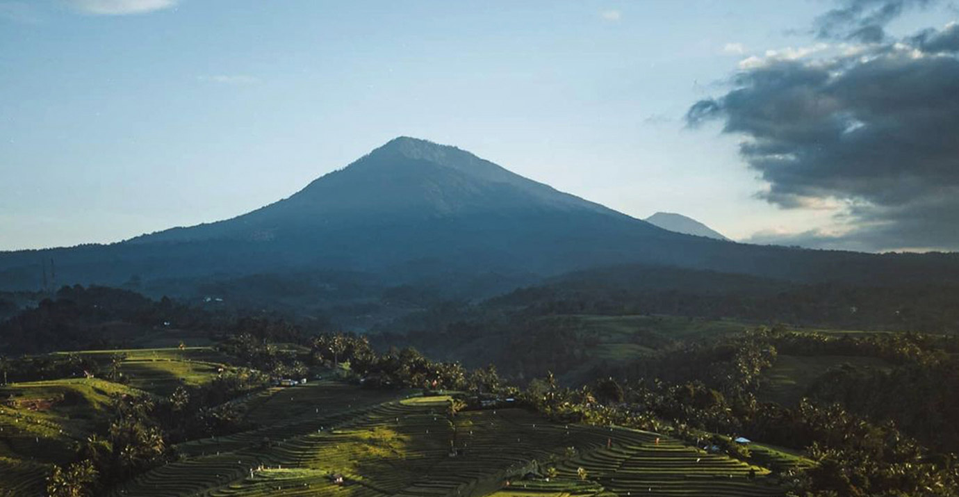 Mount Batukaru behind rice fields in Bali