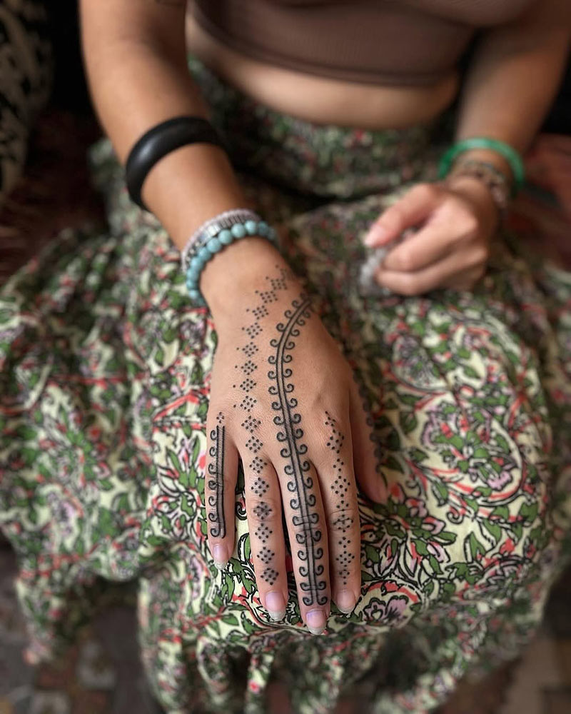 Hand tattoo from Red Peach Tattoo