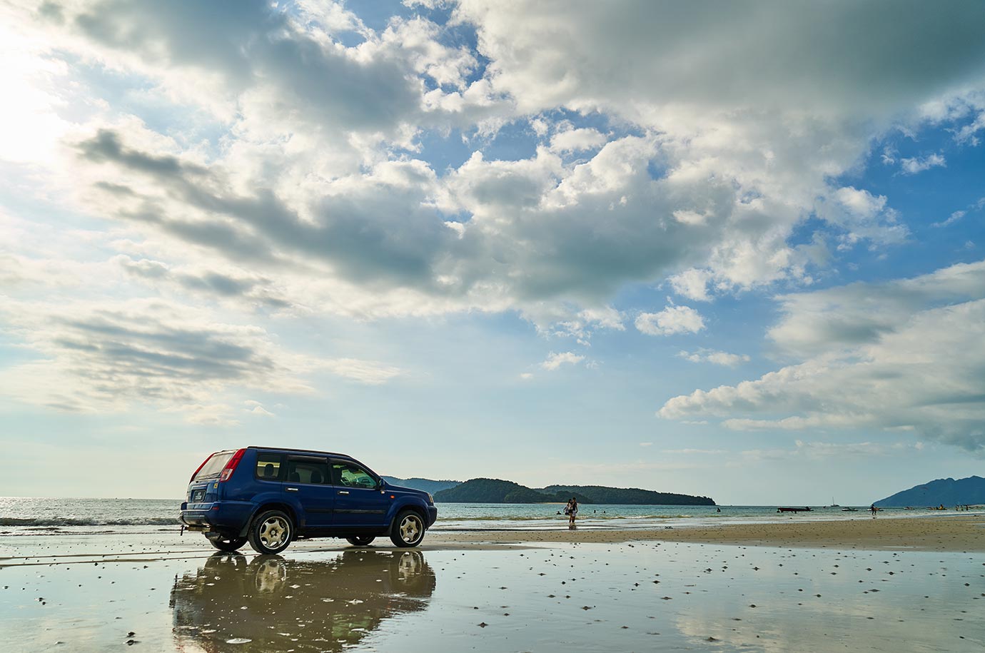 Car on the beach, rented from Madu Sari Car Rental