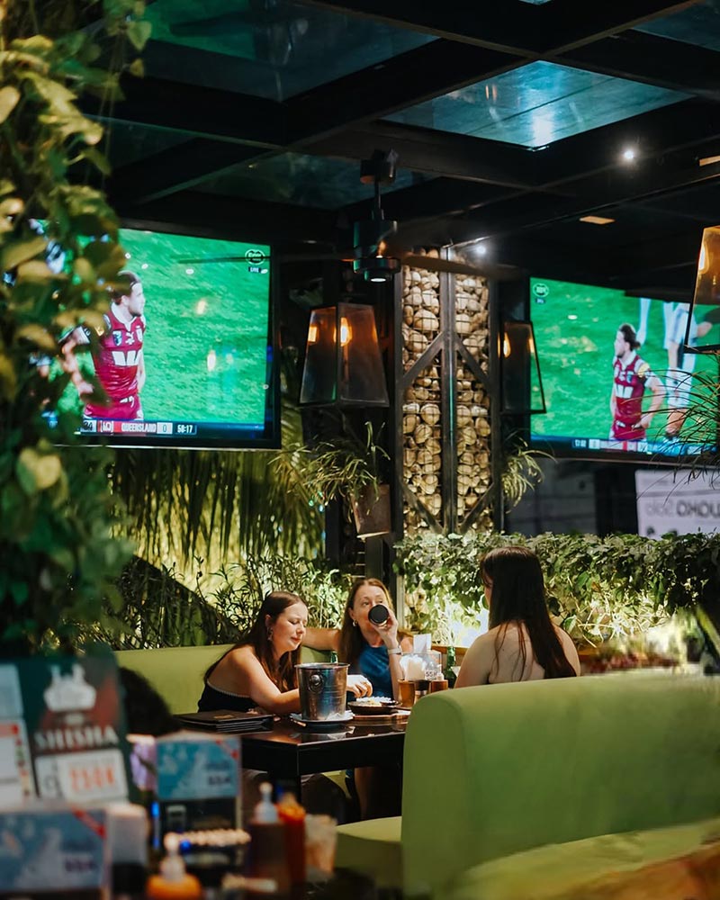 Big screens on the walls in The Forge Bali