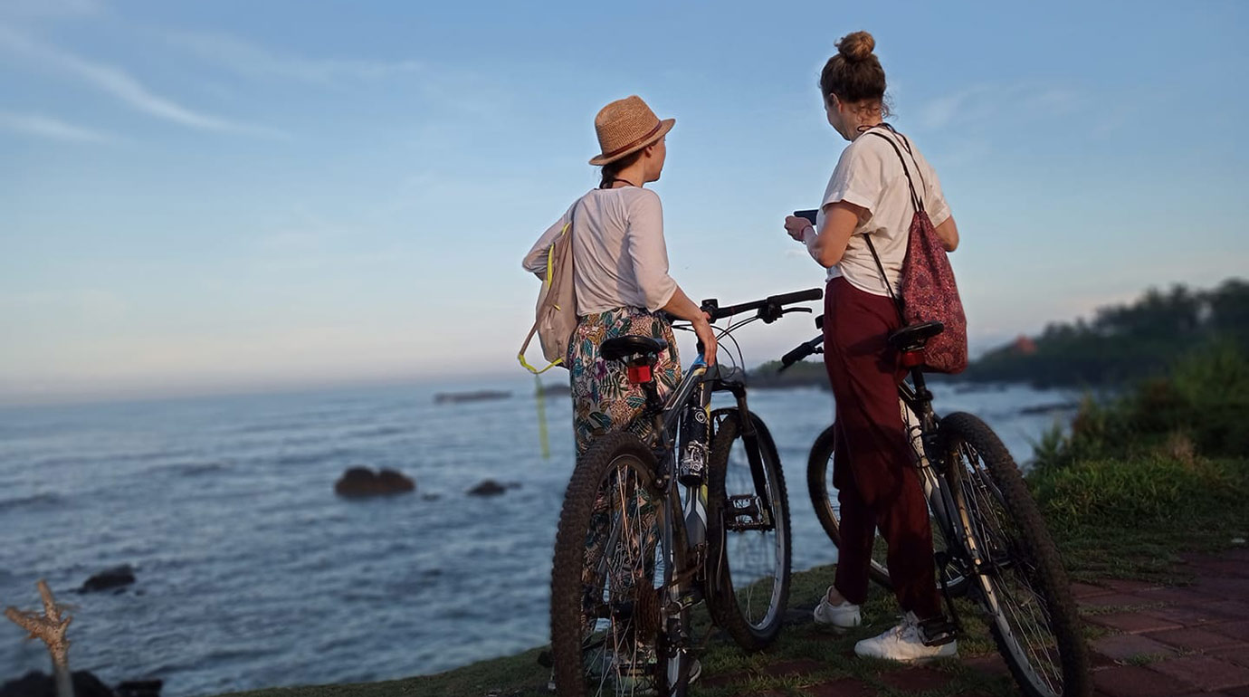 Tourists on the bikes by the beach in Canggu