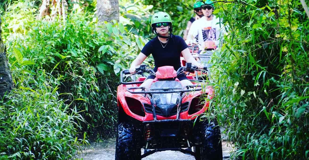 Tourists are riding the ATV at Peliatan Ubud