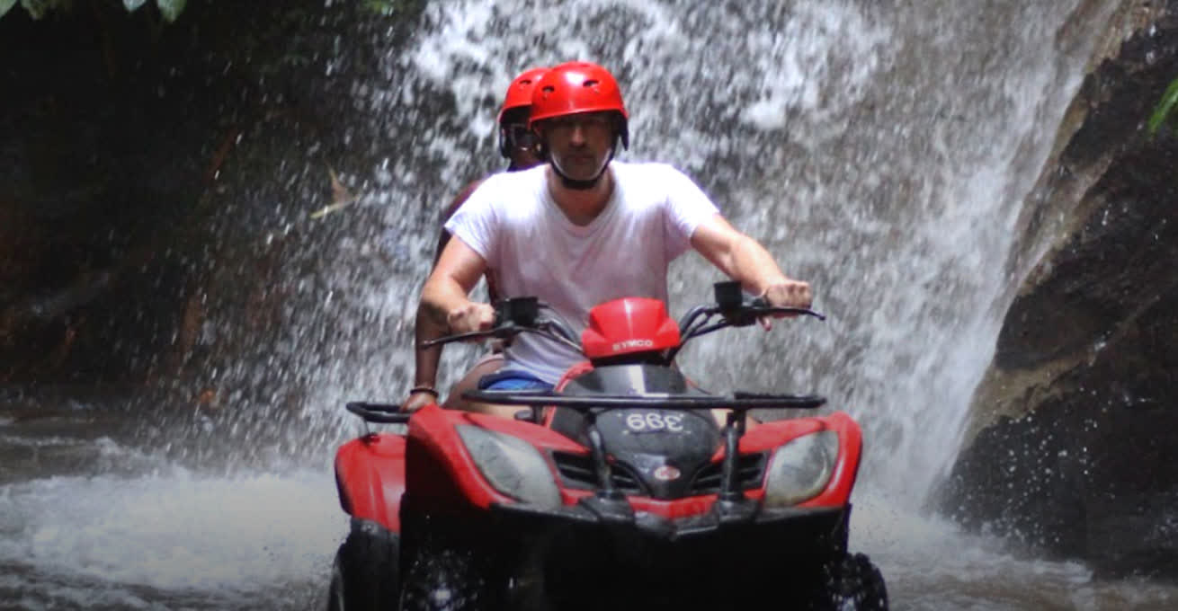 Men are riding the ATV near Tegunungan Waterfall & Coffee Plantation