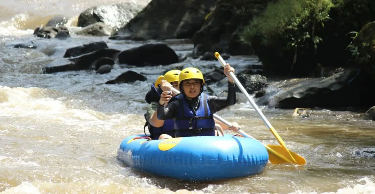The group of people are rafting along Ayung River
