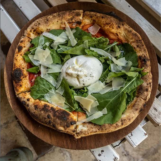 Pizza on the table at L'Osteria Ubud restaurant