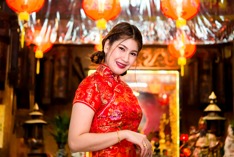 An asian girl in national clothes celebrating Chinese New Year