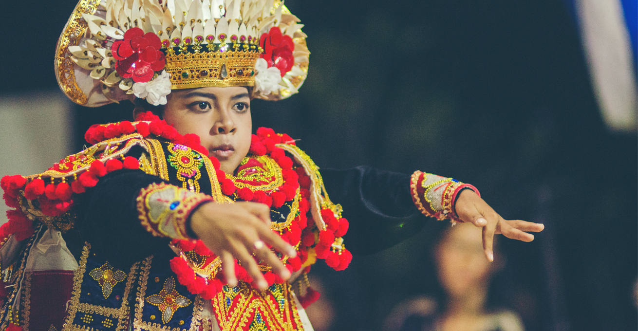 A girl in national costume performs a dance to celebrate the anniversary of Denpasar