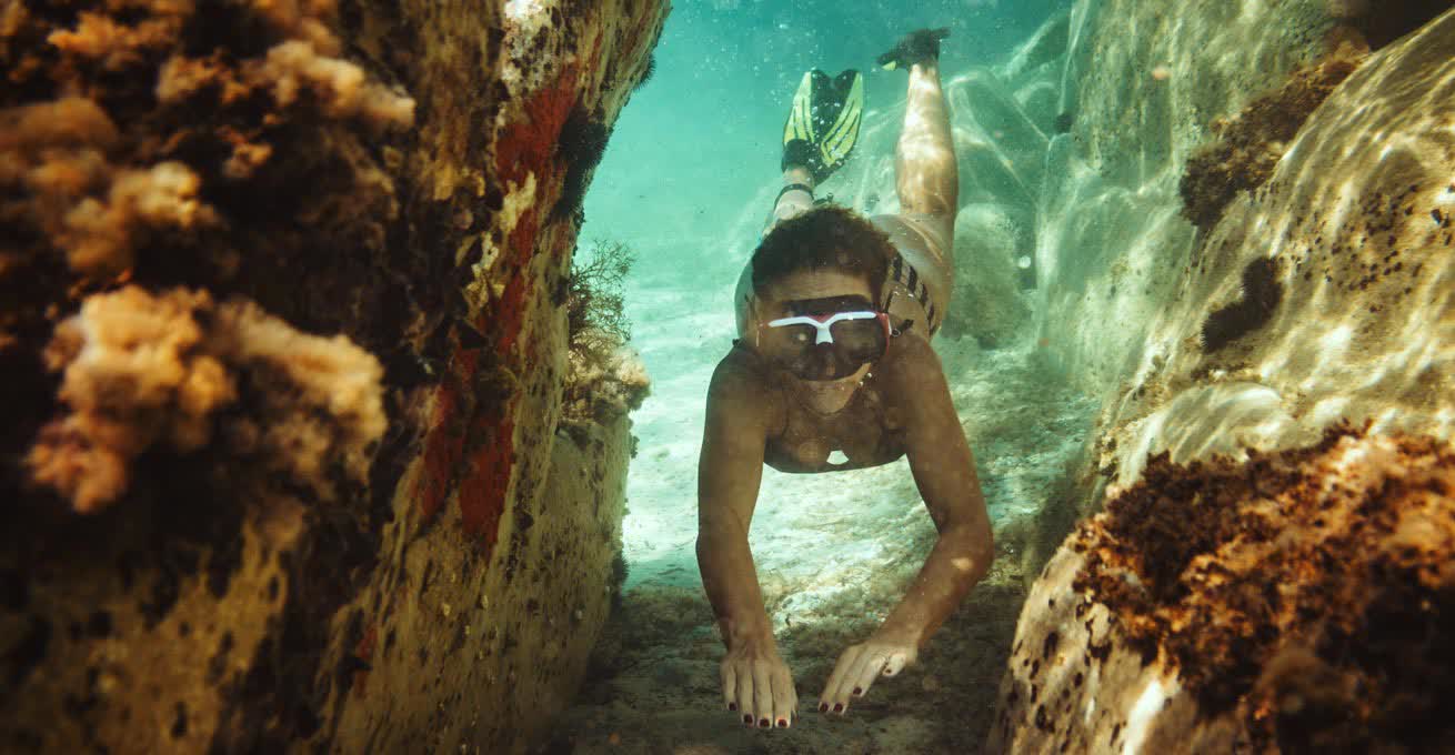 Woman is snorkeling in Amed Wall Jemeluk Bay