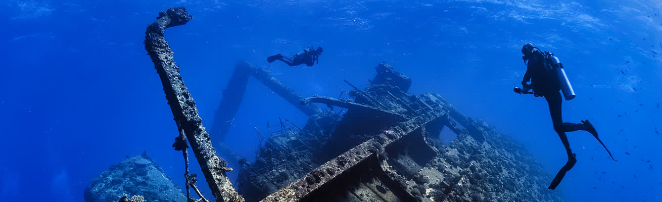 Divers in the deep ocean at the Best Diving Spots in Bali